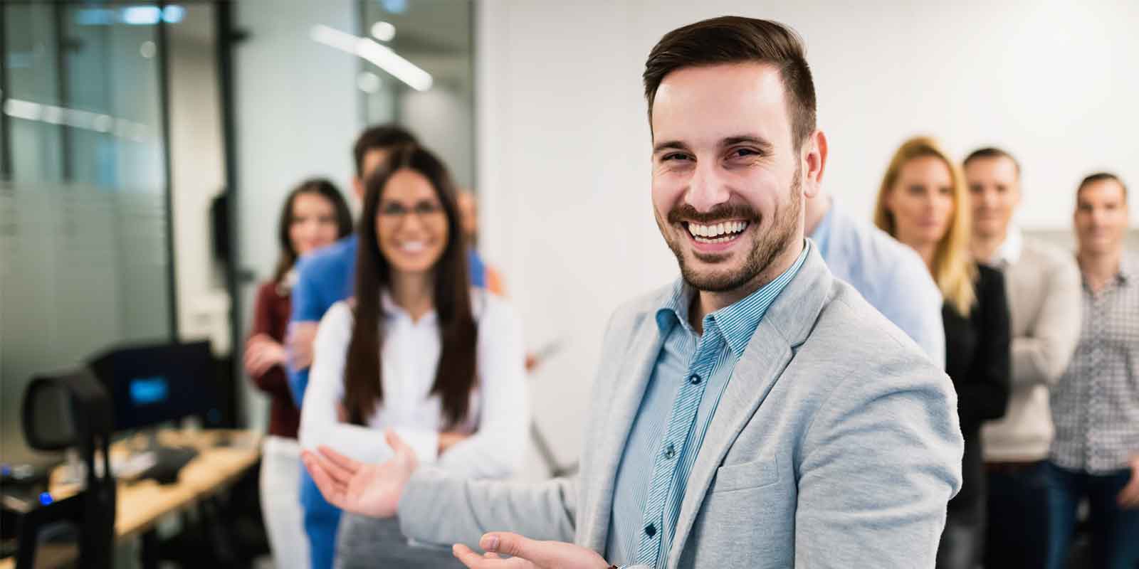 bbg boss smiling with employees