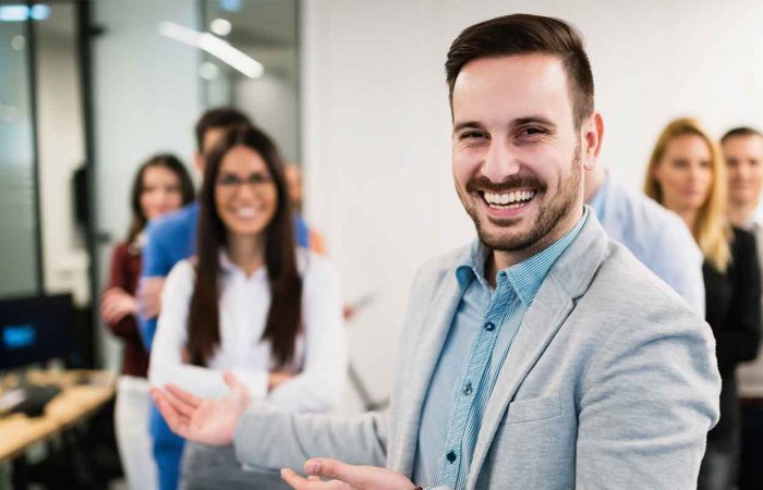 bbg boss smiling with employees bbg boss smiling with employees